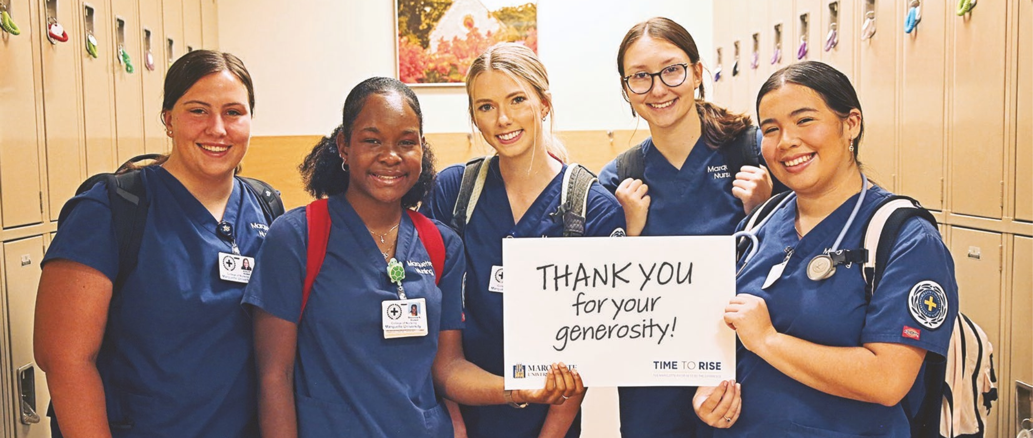 Nursing students holding sign that reads "Thank you for your generosity"